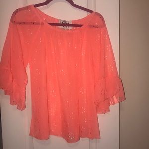 Neon pink top with cutout flowers